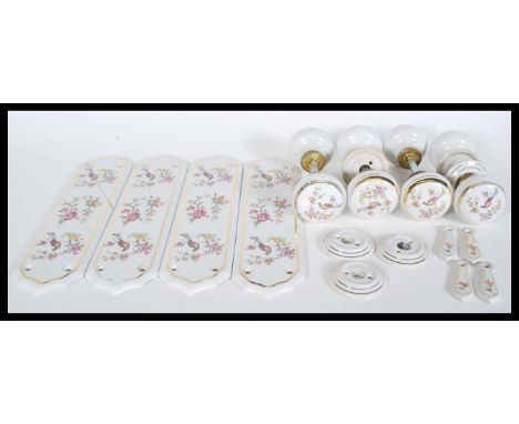 A collection of vintage 20th century ceramic door furniture&nbsp;in the Victorian style with printed Chinese style birds and 