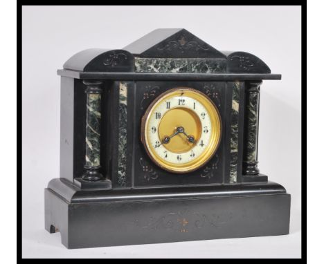 A Victorian 19th century marble and slate mantel clock having inset 8 day movement with markings for Medaille D'Argent. Retai