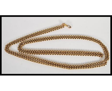 A stamped 15ct gold fob pocket watch chain of long proportions having a clip clasp. Weight 35.5g. Full length 152cm.&nbsp;