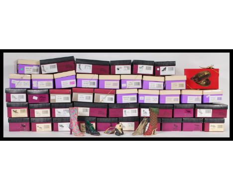 A collection of approximately 40 boxed ' just the right shoe ' figurines including four special edition Raine Forest shoes to