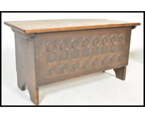 An early 19th Century oak Gothic Pugin revival chest or coffer having carved ecclesiastical&nbsp; arch decoration to sides. T