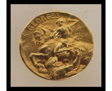 An 18ct gold French medallion of St Georges marked Becker having St George slaying the dragon and a sailing boat the to the v