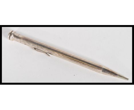 An early 20th Century sterling silver large sized Life Long propelling pencil having engine turned decoration. Weigh 20 grams