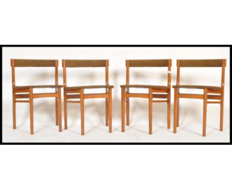 A set of four vintage retro 20th Century teak wedge chairs in the manner of G-Plan raised on four tapering legs with woolen s