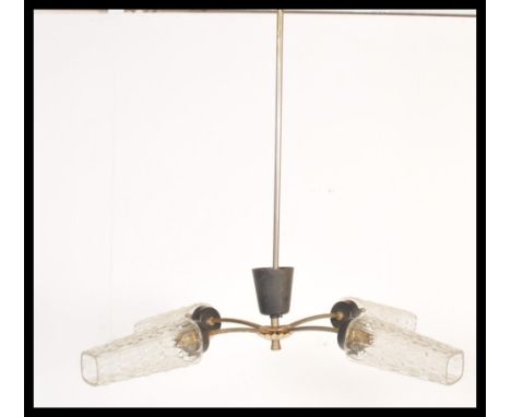 A vintage mid century retro electrolier chandelier having tubular metal form with 3 branches all culminating in pine cone gla