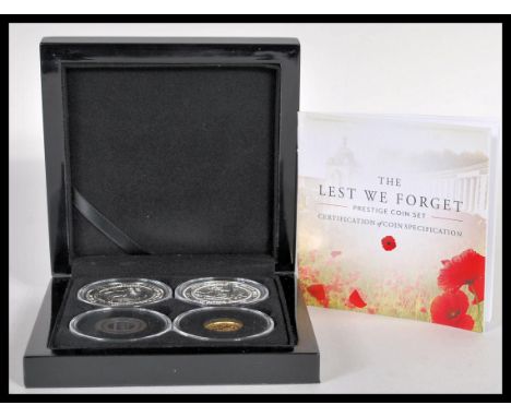 The Lest We Forget Prestige Gold Coin Set - A Bradford Exchange military interest WWI three coin set consisting of a 22ct gol