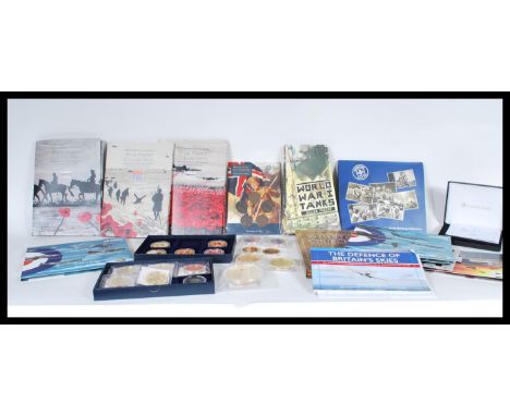 A large collection of contemporary commemorative coins and sets to include mostly Military related examples. set to include S