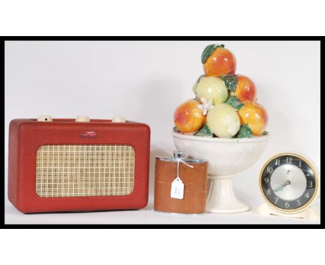 A collection of vintage and retro items to include a red vinyl Roberts radio, a Smiths alarm clock, hip flask and a ceramic b