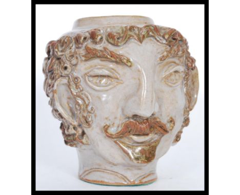After Paul Gauguin (1848-1903). A 20th Century studio pottery "self portrait" head / jar modelled on the Artist Paul Gauguin 