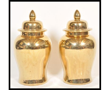 A large pair of decorative gold lustre ginger jars, each of contemporary design being of baluster form complete with lids hav
