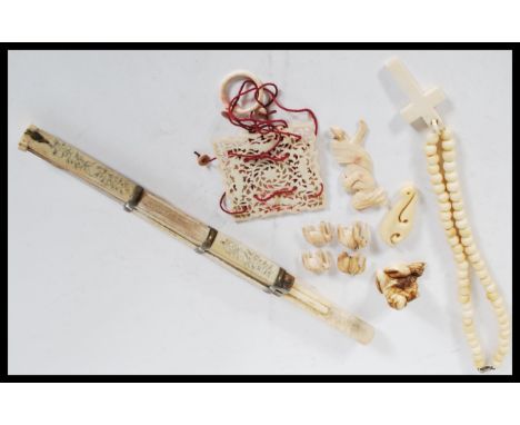 A 19th Century collection of antique ivory items to include crucifix rosary bead necklace, ivory Chinese utensil set with kni