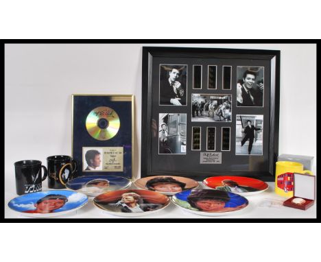 A selection of Cliff Richard collectable items to include limited edition framed film cells, Heathcliffe cameo brooch, a sele