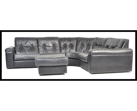 A large 20th century leather modular sofa settee upholstered in black leather to include arched sectional part. The sofa in t