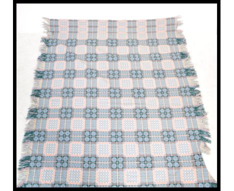 A superb 20th century retro vintage welsh blanket having a vibrant blue ground with repeating geometric patterns throughout a