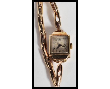 A hallmarked 9ct gold watch having a silvered dial with faceted hands. Complete in original fitted box.