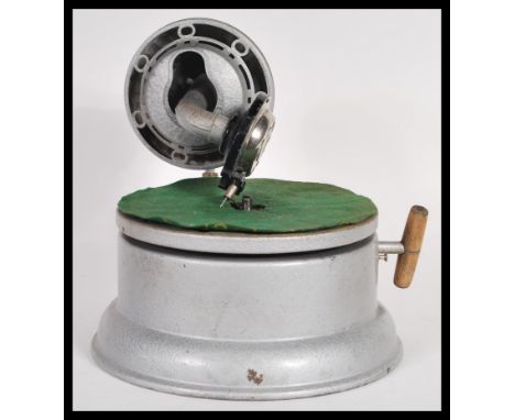 A rare and unusual vintage retro 20th Century small portable gramophone record player having brushed metal body. 23cm high 27