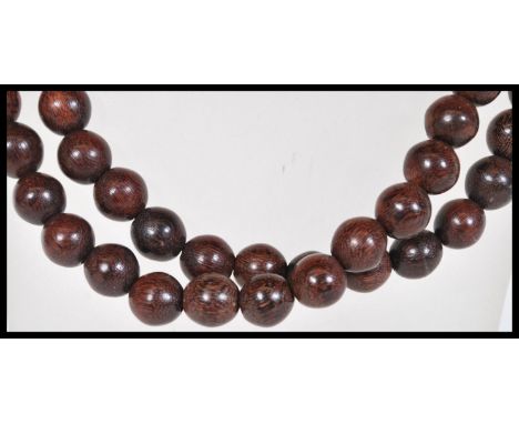 A vintage early 20th Century Chinese / Tibetan 108 bead prayer necklace mala of typical form. Measures 128cm long. Measures 1