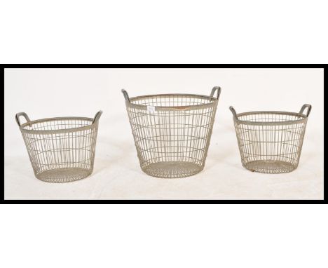 A collection of 3 vintage 20th century Industrial French oyster catcher baskets having loop handles with notation being set o