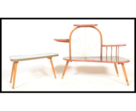 A pair of retro vintage 20th century coffee / side tables having blue melamine top with marble effect top on a taper legs wit