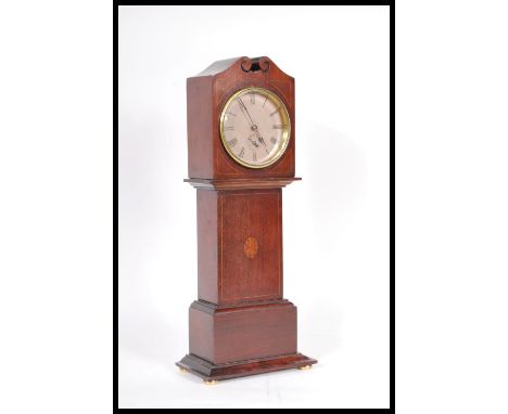 An early 20th Century mahogany miniature grandfather longcase mantel clock having boxwood inlay. The face having Roman Numera