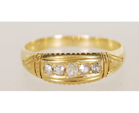 An 18ct gold 5 stone diamond ring, the stones being channel set within gypsy setting, diamonds approx 25pnts