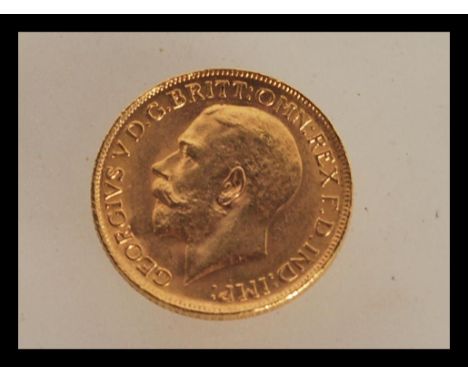 A 22ct gold sovereign dated 1911 with George and the dragon to one side and George V facing left to the verso. Weight 8.0g.