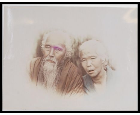 A late 19th Century Victorian hand - tinted albumen print photograph, the mounted studio photograph of an old Japanese husban