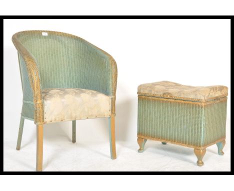 A vintage mid century two tone Lloyd Loom lustre whicker armchair and ottoman basket stool with hinged seat.&nbsp;Measures: 7