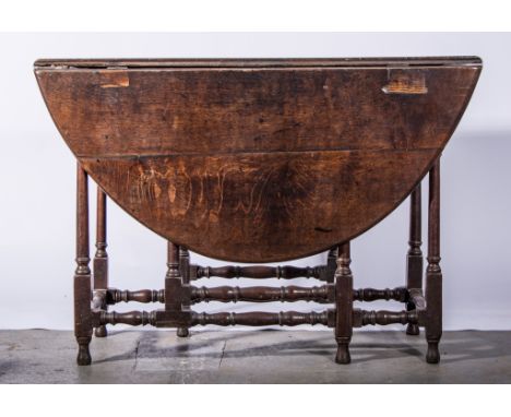 Joined oak gate-leg table, in part 18th century, oval top with two fall leaves, frieze drawer, turned gate legs, the top 115 