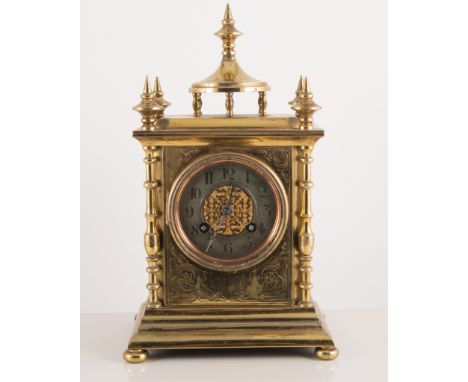 Brass mantel clock, striking on a bell, chapter ring with Arabic numerals, 28cm high.