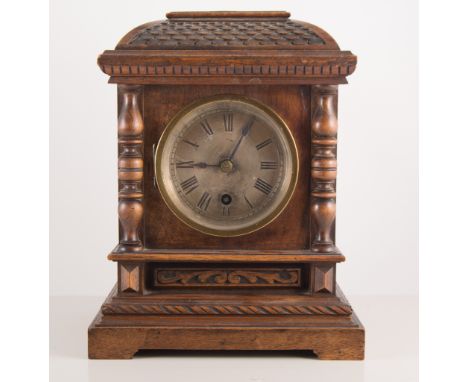 Victorian walnut mantel clock, with pendulum and key, height 29cm.