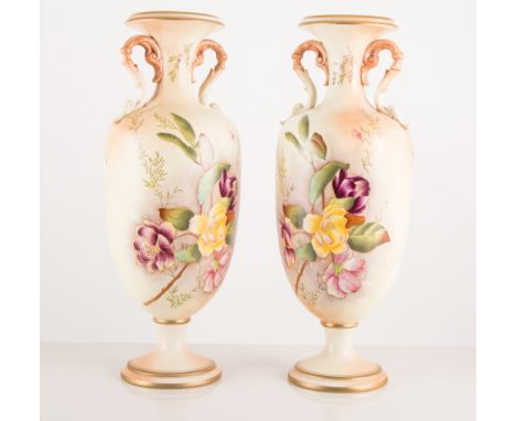 Pair of Carlton ware vases, decorated with fields of floral sprays, 29.5cm high, (one a/f)