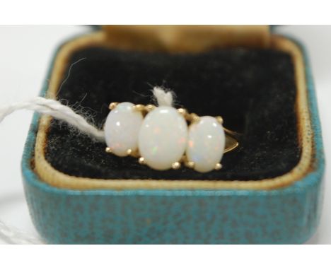 A ladies 9ct gold and cabochon opal set dress ring size N/O