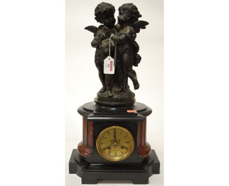 A late Victorian slate mantel clock having circular brass dial with Arabic numerals and cylinder movement striking on a bell 