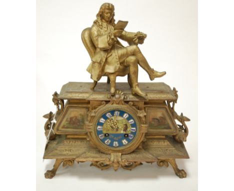 A late 19th century French gilt metal mantel clock having enamelled dial with Roman numerals surmounted by a seated gentleman