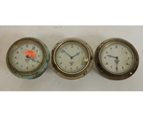 A Smiths instrument panel clock having a silver dial with Arabic numerals signed Smiths, Cricklewood Works, London, together 