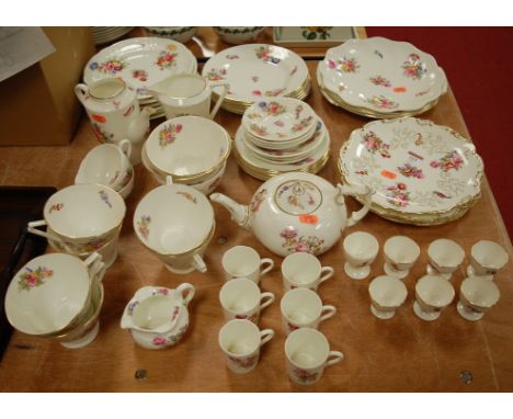 An early 20th century Coalport part tea and dinner service with floral decoration to include teapot, coffee cans and eggcups 