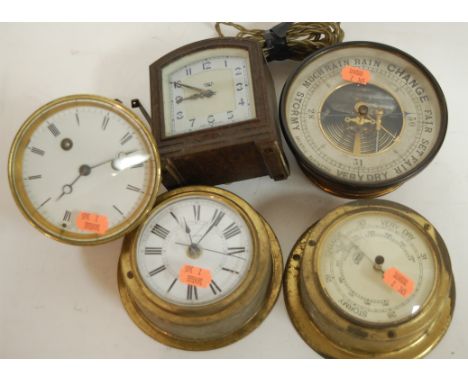 An early 20th century Smiths bakelite cased mantel clock together with brass cased ships clock, two barometers etc
