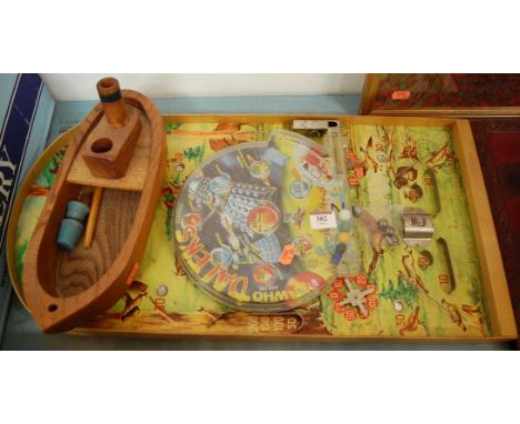 A mid 20th century child's bagatelle board together with a Dr Who dalek's bagatelle game and model boat (3)