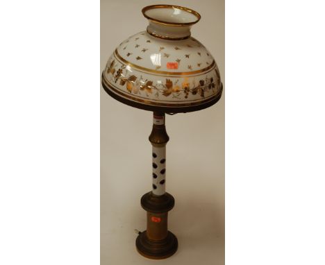 An early 20th century brass and glass overlaid pedestal table lamp, the opalescent glass shade with gilt decoration