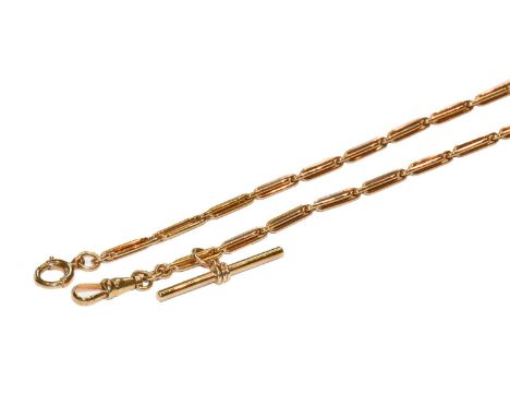 A figaro link chain, stamped '9CT', suspending a 9 carat gold T-bar, length 34.5cmCondition report: The chain is in good cond