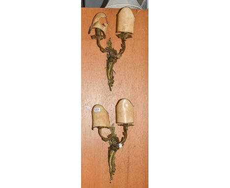A pair of 19th century brass twin-light wall sconces later fitted for electricity, together with a similar twin branch wall l