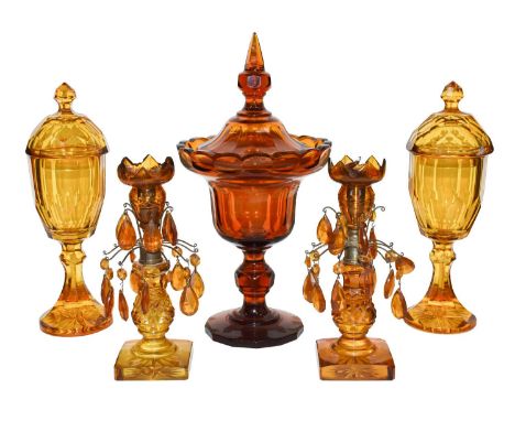 A pair of 19th century Bohemian amber glass castelettes, a similar large pedestal bowl and cover, and a pair of table lustres