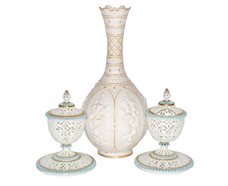 A pair of Grainger &amp; Co Worcester reticulated vases, covers and stands (one cover a.f.), each 15.5cm high; together with 