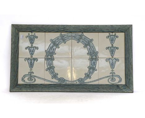 A Pilkington's panel of eight tiles, tube lined on a cream ground with a stylised wreath; together with a Pilkington's sgraff