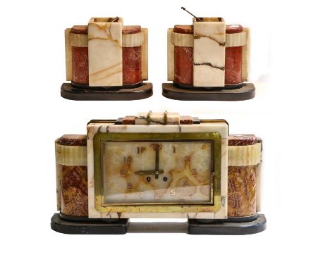 An Art Deco marble and onyx striking mantel clock garnitureCondition report: Clockcase and garniture with minor chips to edge