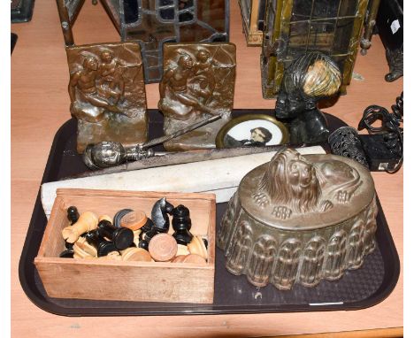~A tray of assorted items, including: a whalebone toddy ladle, a Victorian white metal babies rattle, a boomerang, an African