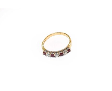 An 18 carat gold ruby and diamond ring, finger size M1/2Condition report: The ring is in good condition. It is hallmarked wit