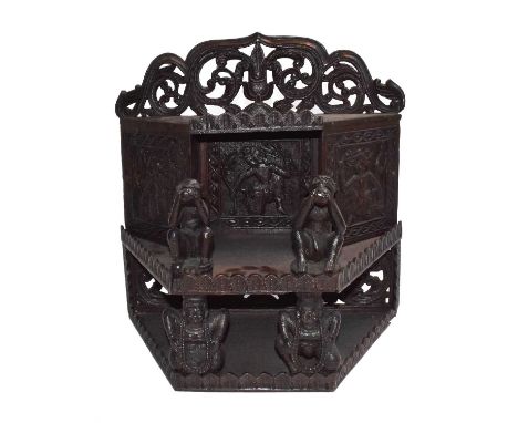 A carved hardwood Asian wall shelf