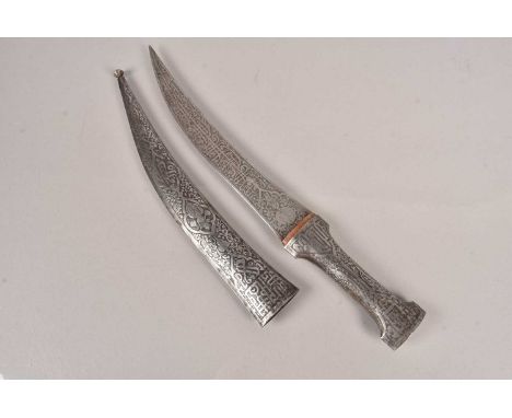 An North Indian Mughal dagger, having double sided decorative blade, with similar decorated grip and scabbard, no postage for